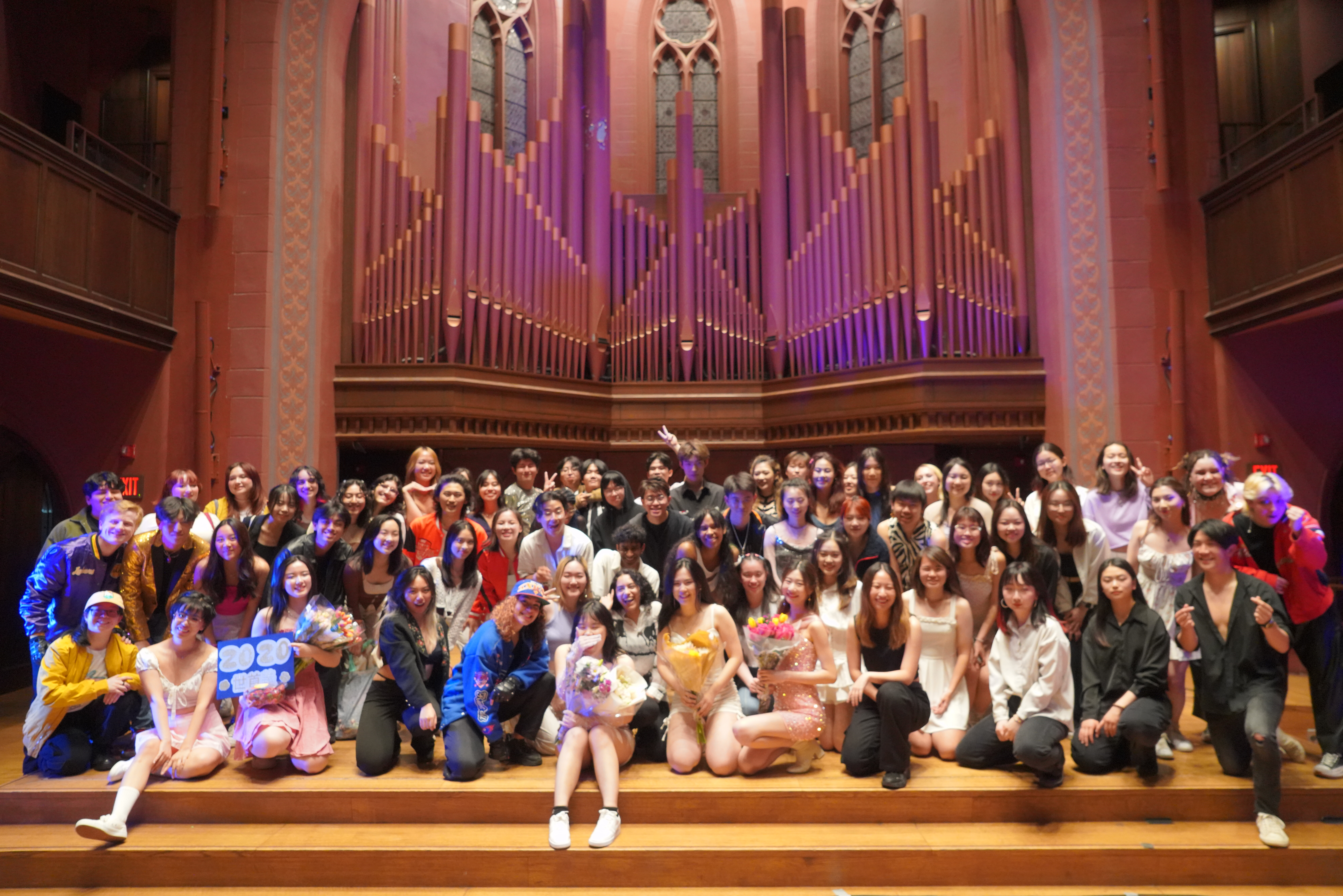 A group photo of the K-Pop Dance Collective group at the Memorial Chapel.